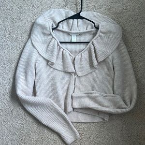 Ruffled beige sweater